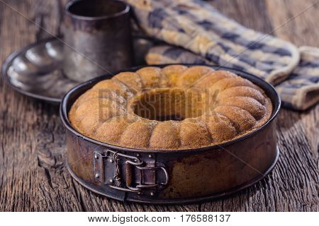 Marble cake.Easter Cake. Marble cake cup of coffee powder sugar and kitchen vintage utensil.