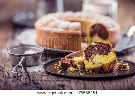 Marble cake.Easter Cake. Marble cake cup of coffee powder sugar and kitchen vintage utensil.