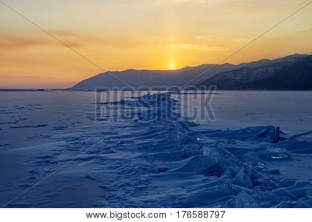 Lake Baikal in winter at sunset. Ice hummocks