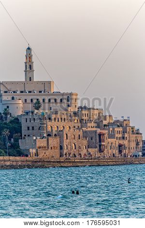 TEL AVIV, ISRAEL - MAY 22, 2016: View of Jaffa old city at sunset from the beach.