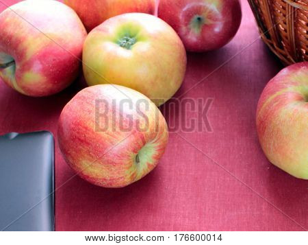 apple red on rose background basket agriculture garden harvest taste fresh collection heap disorder tablet black