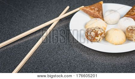 Delicious Assortment Of Homemade Asian Pastries. Samosas With A Rose Flower And Banana Balls