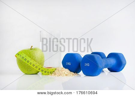 Dumbbell green apple and soft meter. sport and training
