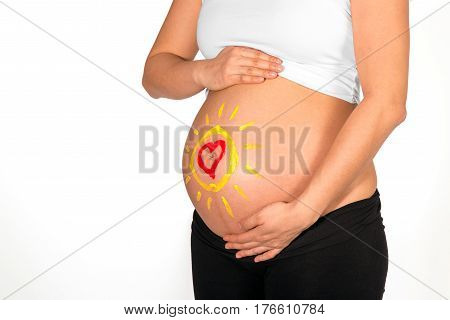 Sun And Heart Painted On Belly Of Pregnant Woman