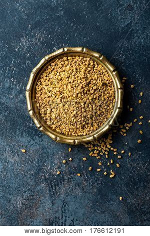 Fenugreek seeds on metal plate spice culinary ingredient