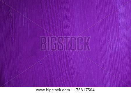 Purple wood texture. Purple wood background. Closeup view of purple wood texture and background. Abstract background and texture for designers. Texture of vintage handmade table. Rustic table.