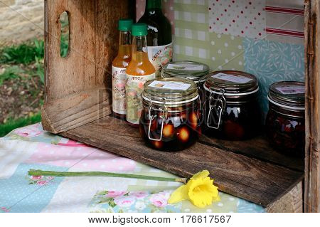 LACOCK, UK - MARCH 11, 2017: Homemade juice, pickles and jam for sale in small village of Lacock, England. Buyer are asked to pay for products into honesty box.