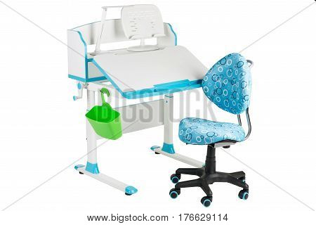 Blue chair blue school table green basket and desk lamp on the white isolated background.