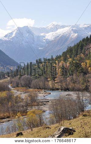 The River Flows Between The Mountains