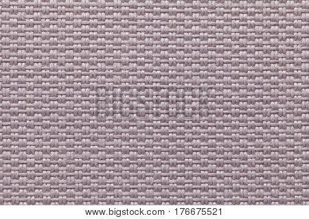 Light brown background with checkered pattern closeup. Structure of the fabric macro.