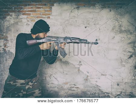 Terrorist In Black Uniform And Mask With Kalashnikov