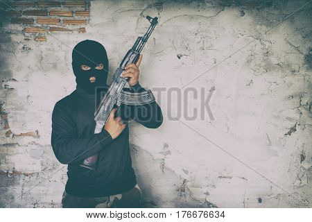 Terrorist In Black Uniform And Mask With Kalashnikov