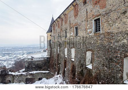 Wall and bastions of ancient castle Palanok in Mukacheve Ukraine. Winter time.