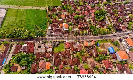Beautiful landscape with balinese village and rice fields, Bali, Indonesia. Aerial view.