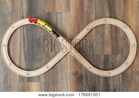 View from above wooden train and railway for kids on wooden floor