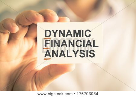 Businessman Holding Card With Dfa Dynamic Financial Analysis Acronym Text