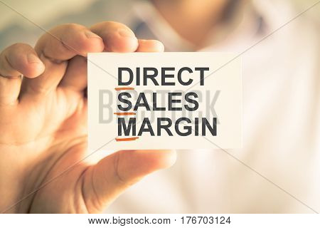 Businessman Holding Card With Dsm Daily Sales Margin Acronym Text