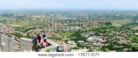 Tourists Enjoying The View From La Rocca Fortless On Borgo Maggiore, San Marino