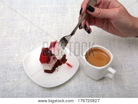 Slice of handmade cherry pie on a plate and classic espresso coffee in white background.