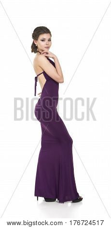 Young smiling girl posing in a dress. Studio shot on white background. The isolated image.