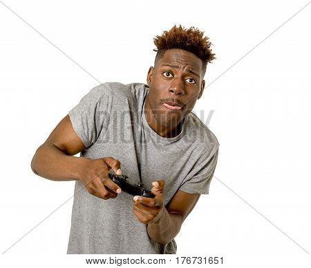 young attractive black afro american man using remote controller playing video game happy and excited having fun isolated on white background in gamin technology concept