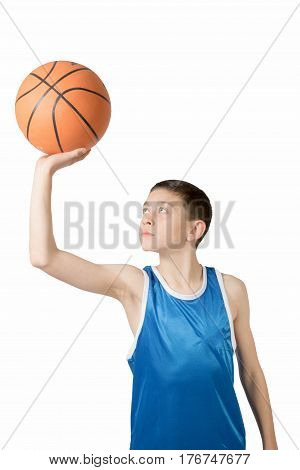 Young caucasian teenage boy with a basketball