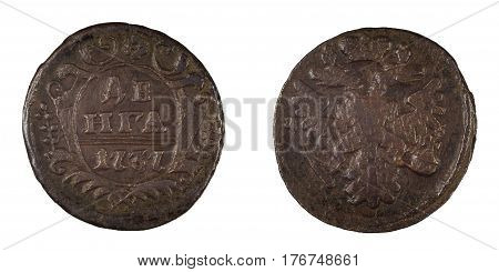 Old russian coin during the reign of the Empress and Autocrat of All-Russia Anna Ivanovna Romanova with the emblem of an eagle and a shield with floral ornaments