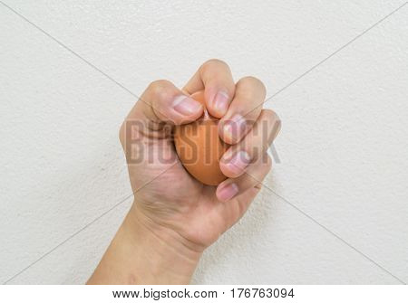 woman holding a egg on white background
