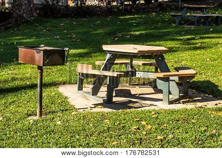 Picnic Bench With BBQ At Local Park