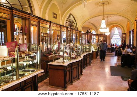 People Shopping And Eating In The Famous Gerbeaud Coffe Shop