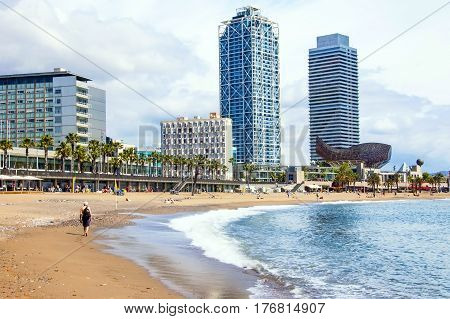 Barcelona, Spain - May 1, 2012.  Visiting The Barceloneta Beach.