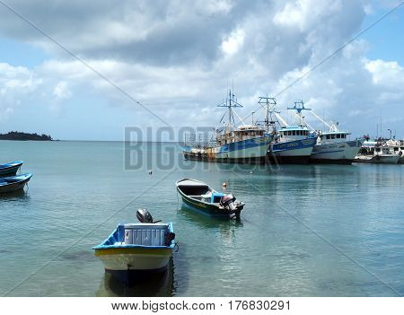 CORN ISLAND NICARAGUA-MARCH 13: Commericial fishing boats and private boats are seen in Caribbean Sea in Brig Bay harbor in Big Corn Island Nicaragua Central America on March 13 2017.
