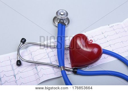 RX prescription, Red heart, asorted pils and a stethoscope on white background.