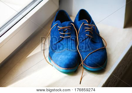 Pair of elegant grooms blue suede brogue shoes
