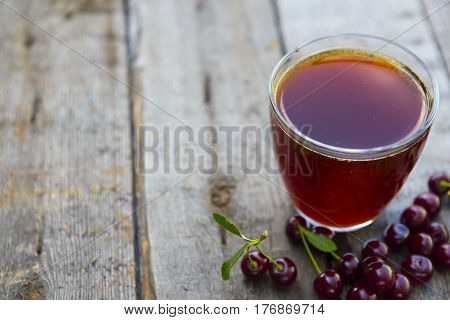 Homemade Cherry Juice In Glass With Freshcherry On Wooden Table. Fresh Fruit Drink