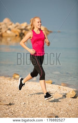 Jogging In Th Beach - Woman Runns Near Sea On Early Summer Morning