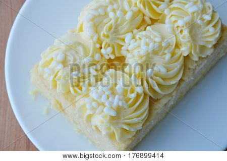 vanilla chiffon cake topping cream on dish