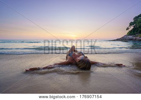 Woman on the beach in Surin Phuket Thailand
