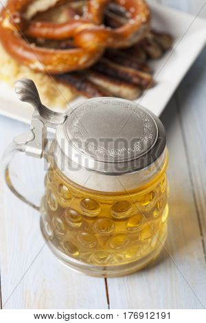 beer in a mug and nuremberg bratwurst