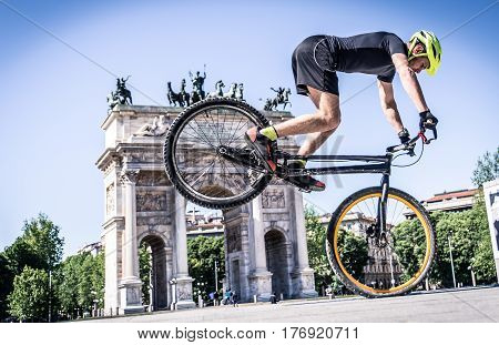 Young athlete making tricks on his bicycle
