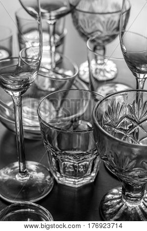 Clean different glasses on gray background. vertical