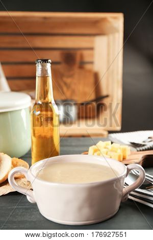Delicious cream soup in pan on table