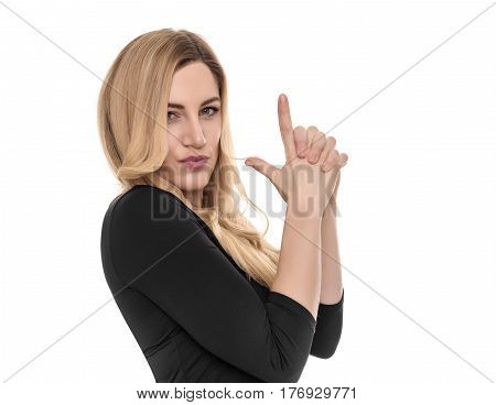 Blonde holds an impromptu pistol in her hands. On a white background.