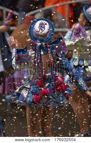 ORURO, BOLIVIA - FEBRUARY 25, 2017: Caporales dancers in ornate costumes performing as they parade through the mining city of Oruro on the Altiplano of Bolivia during the annual carnival.