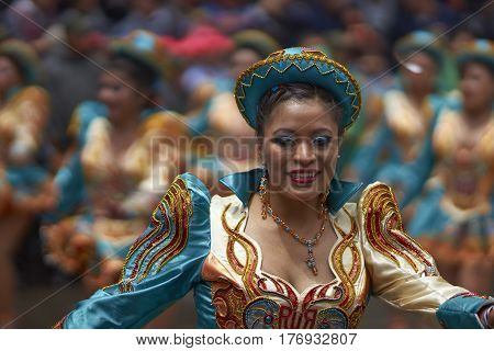 ORURO, BOLIVIA - FEBRUARY 25, 2017: Caporales dancer in ornate costume parading through the mining city of Oruro on the Altiplano of Bolivia during the annual carnival.