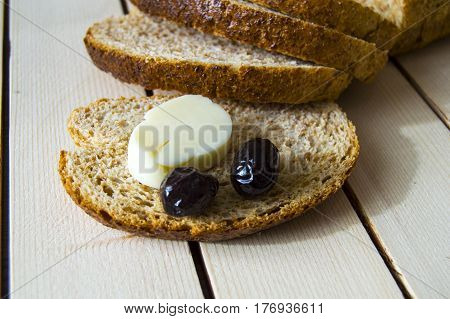Bran bread and besides black olives, cheese, the most beautiful breakfast cheese and black olives.In different concepts bread, olive and cheese pictures,