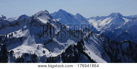 Mount Rophaien and other snow covered mountains seen from mount Fronalpstock.