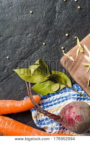 Beets, Carrots And Cabbage During Cooking. Composition On A Dark Background.