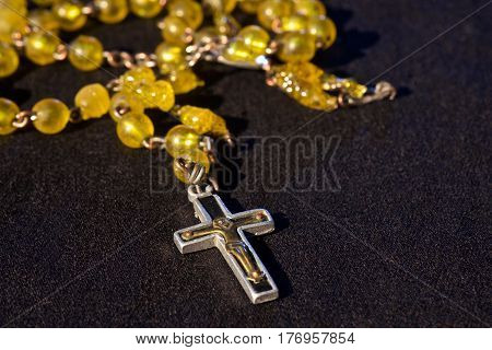 rosary on blackground with free space for text