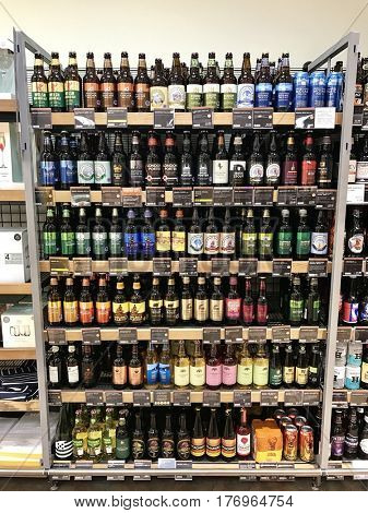 READING - MARCH 12, 2017: Colourful varieties of craft beers, ales and lagers line the shelves of Marks and Spencer (M&S) Simply Food in Lower Earley, Reading, Berkshire, UK.